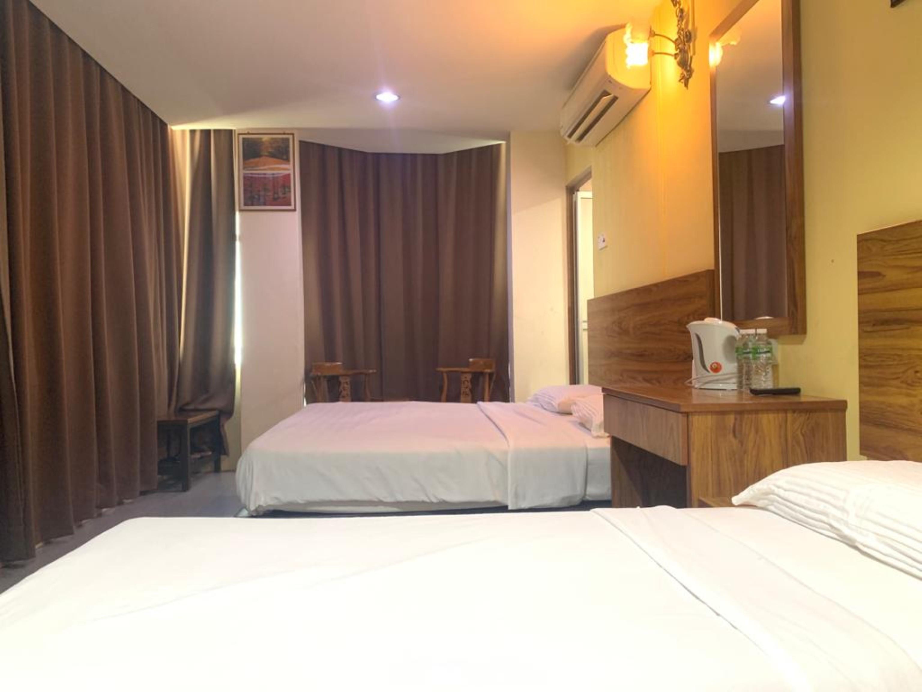 Oyo 89877 Sun Triang Hotel Kampong Kerayong Екстериор снимка